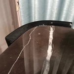 Sculptural Black Marble Sofa Side Table with Curved Dark Wood Panels and Open Architectural Base